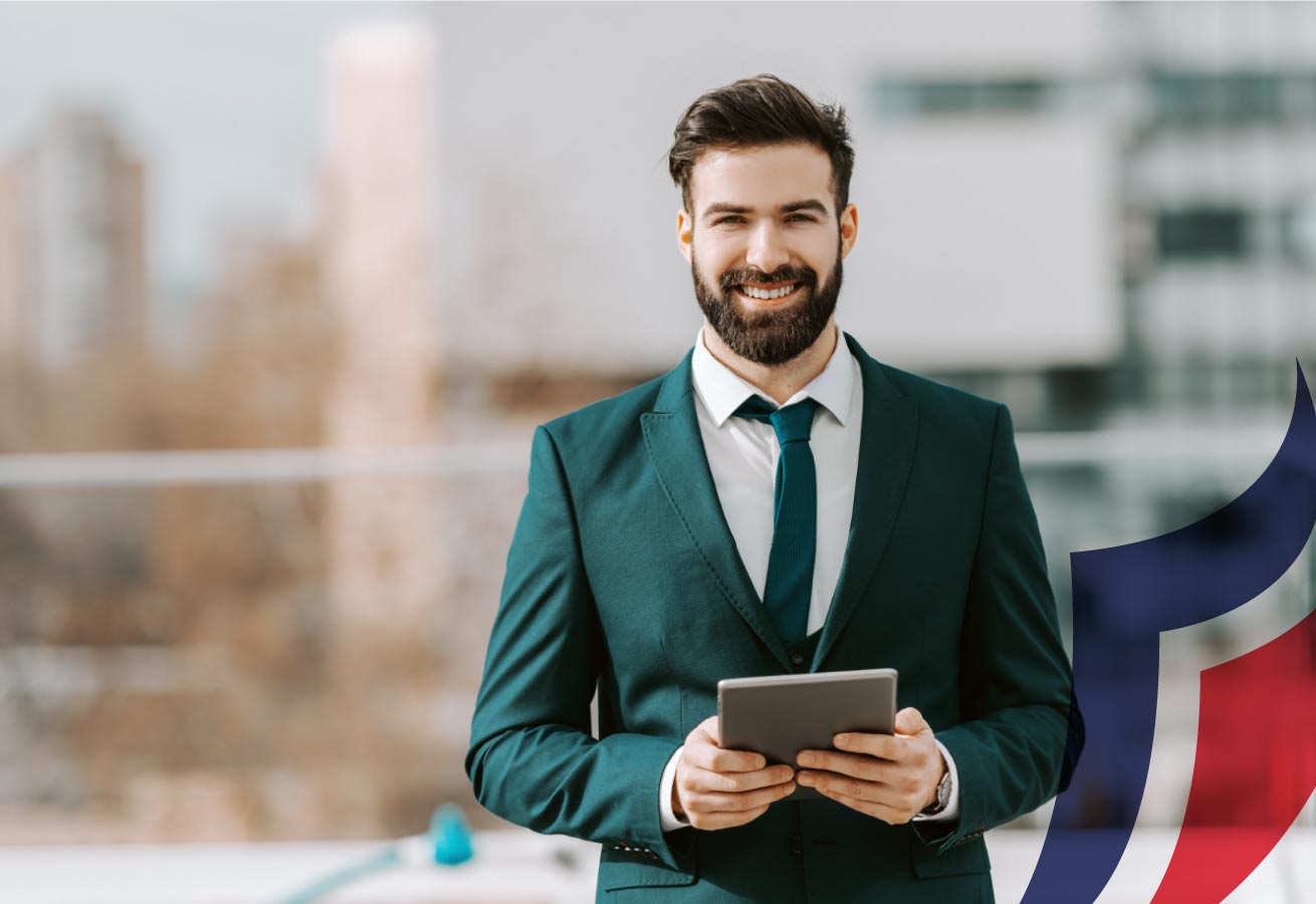 Businessman smiling holding pad