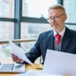 Businessman working on a desk with Laptop