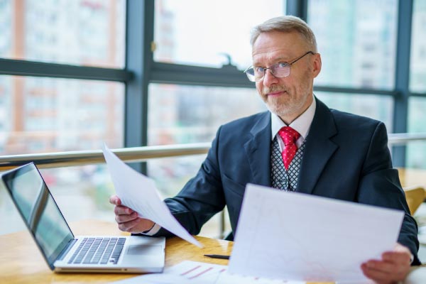 Businessman working on a desk with Laptop